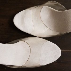 Vintage clear Lucite peep toe heels.